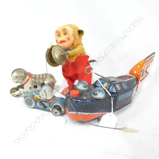 2 TIN PLATE WIND UP TOYS; ROCKET SHIP -. BUG EYES & CAT WITH BALL  & PLASTIC WIND UP MONKEY WITH SYMBOLS